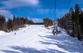 Picturesque panorama of the Carpathian Mountains and chair lift. Winter holidays and fun in the mountains Royalty Free Stock Photo